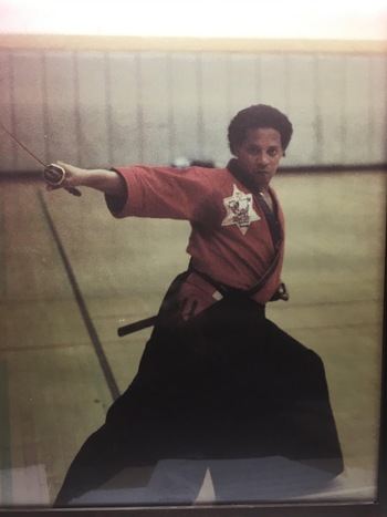 Greg Tearney performing a weapon kata in the dojo's early years