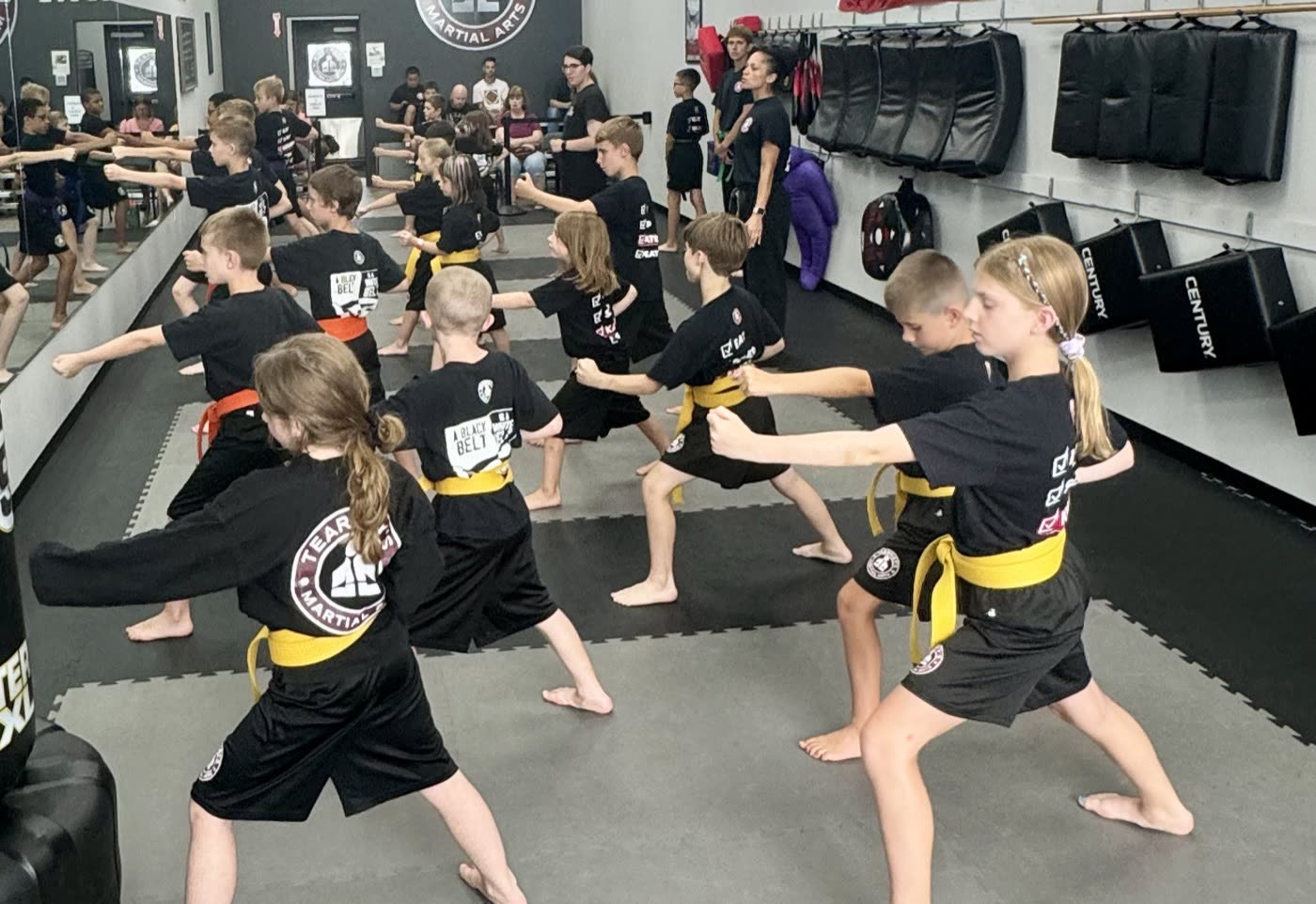 Kids practicing karate stances at Tearney's